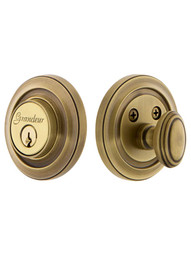 Grandeur Single-Cylinder Deadbolt with Circulaire Plates Keyed Alike in Antique Brass.